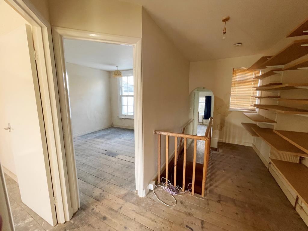 Lot: 66 - THREE-BEDROOM HOUSE FOR REFURBISHMENT/REPAIR - Landing with access to bedrooms and bathroom